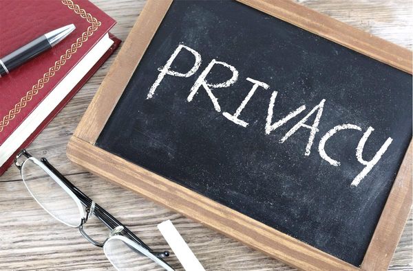 A chalkboard with the word "privacy" on it